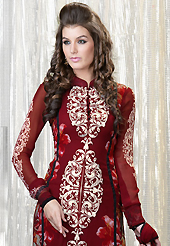 Your search for elegant look ends here with this lovely suit. The dazzling maroon faux georgette churidar suit have amazing floral print and embroidery patch work is done with resham and stone work. Beautiful embroidery work on kameez is stunning. The entire ensemble makes an excellent wear. Matching santoon churidar and chiffon dupatta is available with this suit. Slight Color variations are possible due to differing screen and photograph resolutions.