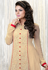 Dreamy variation on shape and forms compliment your style with tradition. The dazzling light fawn faux georgette churidar suit have amazing embroidery patch work is done with resham and stone work. Beautiful embroidery work on kameez is stunning. The entire ensemble makes an excellent wear. Matching santoon churidar and red chiffon dupatta is available with this suit. Slight Color variations are possible due to differing screen and photograph resolutions.