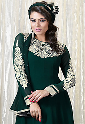 The glamorous silhouette to meet your most dire fashion needs. The dazzling bottle green faux georgette churidar suit have amazing embroidery patch work is done with resham work. Beautiful embroidery work on kameez is stunning. The entire ensemble makes an excellent wear. Matching santoon churidar and chiffon dupatta is available with this suit. Slight Color variations are possible due to differing screen and photograph resolutions.