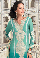 Outfit is a novel ways of getting yourself noticed. The dazzling shaded sea green georgette churidar suit have amazing embroidery patch work is done with resham and lace work. The entire ensemble makes an excellent wear. Contrasting cream santoon churidar and cream chiffon dupatta is available with this suit. Slight Color variations are possible due to differing screen and photograph resolutions.