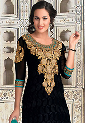 The glamorous silhouette to meet your most dire fashion needs. The dazzling black georgette churidar suit have amazing embroidery patch work is done with resham work. The entire ensemble makes an excellent wear. Contrasting turquoise green santoon churidar and turquoise green chiffon dupatta is available with this suit. Slight Color variations are possible due to differing screen and photograph resolutions.