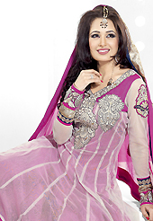 The most beautiful refinements for style and tradition. The dazzling magenta and cream net anarkali churidar suit have amazing embroidery patch work is done with resham and zari work. Beautiful embroidery work on kameez is stunning. The entire ensemble makes an excellent wear. Contrasting off white santoon churidar and magenta chiffon dupatta is available with this suit. Slight Color variations are possible due to differing screen and photograph resolutions.