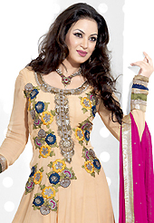 Breathtaking collection of suits with stylish embroidery work and fabulous style. The dazzling apricot net anarkali churidar suit have amazing embroidery patch work is done with resham, zari, stone and lace work. Beautiful embroidery work on kameez is stunning. The entire ensemble makes an excellent wear. Matching santoon churidar and dark pink chiffon dupatta is available with this suit. Slight Color variations are possible due to differing screen and photograph resolutions.