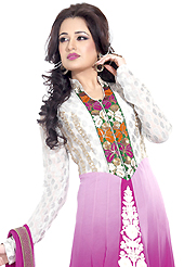 Look stunning rich with dark shades and floral patterns. The dazzling white and shaded magenta georgette anarkali churidar suit have amazing embroidery patch work is done with resham and zari work. Beautiful embroidery work on kameez is stunning. The entire ensemble makes an excellent wear. Matching magenta santoon churidar and magenta chiffon dupatta is available with this suit. Slight Color variations are possible due to differing screen and photograph resolutions.