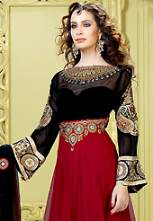 Your search for elegant look ends here with this lovely suit. The dazzling maroon and black net churidar suit have amazing embroidery patch work is done with resham, zari, sequins, stone and beads work. Beautiful embroidery work on kameez is stunning. The entire ensemble makes an excellent wear. Matching black santoon churidar and black net dupatta is available with this suit. Slight Color variations are possible due to differing screen and photograph resolutions.