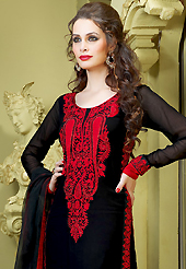Dreamy variation on shape and forms compliment your style with tradition. The dazzling black faux georgette pakistani style churidar suit have amazing embroidery patch work is done with resham and stone work. Beautiful embroidery work on kameez is stunning. The entire ensemble makes an excellent wear. Matching santoon churidar and faux chiffon dupatta is available with this suit. Slight Color variations are possible due to differing screen and photograph resolutions.