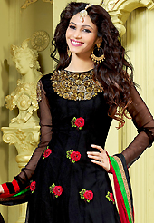 This season dazzle and shine in pure colors. The dazzling black net churidar suit have amazing embroidery patch work is done with resham, zari, sequins and stone work. Beautiful embroidery work on kameez is stunning. The entire ensemble makes an excellent wear. Contrasting dark red santoon churidar and dark red faux chiffon dupatta is available with this suit. Slight Color variations are possible due to differing screen and photograph resolutions.