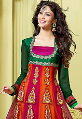 Look stunning rich with dark shades and floral patterns. The dazzling dark orange, magenta and dark green net churidar suit have amazing embroidery patch work is done with resham, zari and stone work. Beautiful embroidery work on kameez is stunning. The entire ensemble makes an excellent wear. Matching dark green santoon churidar and dark green and magenta dupatta is available with this suit. Slight Color variations are possible due to differing screen and photograph resolutions.