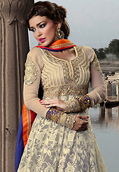 Attract all attentions with this embroidered suit. The dazzling cream net long style anarkali churidar suit have amazing embroidery patch work is done with resham, zari, stone and lace work. Beautiful embroidery work on kameez is stunning. The entire ensemble makes an excellent wear. Matching santoon churidar and orange and blue dupatta is available with this suit. Slight Color variations are possible due to differing screen and photograph resolutions.