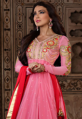 It is color this season and bright shaded suits are really something that is totally in vogue. The dazzling pink net long style anarkali churidar suit have amazing embroidery patch work is done with resham, zari, sequins, stone and latken work. Beautiful embroidery work on kameez is stunning. The entire ensemble makes an excellent wear. Matching dark pink santoon churidar and dark pink chiffon dupatta is available with this suit. Slight Color variations are possible due to differing screen and photograph resolutions.