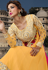 A desire that evokes a sense of belonging with a striking details. The dazzling dark yellow georgette long style anarkali churidar suit have amazing embroidery patch work is done with resham, sequins, stone and lace work. Beautiful embroidery work on kameez is stunning. The entire ensemble makes an excellent wear. Matching santoon churidar and pink chiffon dupatta is available with this suit. Slight Color variations are possible due to differing screen and photograph resolutions.
