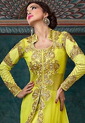 Dreamy variation on shape and forms compliment your style with tradition. The dazzling lime green net long style anarkali churidar suit have amazing embroidery patch work is done with resham, zari, stone and lace work. Beautiful embroidery work on kameez is stunning. The entire ensemble makes an excellent wear. Matching santoon churidar and chiffon dupatta is available with this suit. Slight Color variations are possible due to differing screen and photograph resolutions.