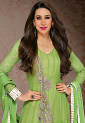 Get ready to sizzle all around you by sparkling suit. The dazzling green net anarkali churidar suit have amazing embroidery patch work is done with resham, zari, stone and beads work. Beautiful embroidery work on kameez is stunning. The entire ensemble makes an excellent wear. Matching santoon churidar and chiffon dupatta is available with this suit. Slight Color variations are possible due to differing screen and photograph resolutions.