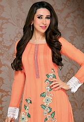 The color range from natural shades looks ravishing. The dazzling light orange georgette churidar suit have amazing embroidery patch work is done with resham and lace work. Beautiful embroidery work on kameez is stunning. The entire ensemble makes an excellent wear. Contrasting green santoon churidar and light orange dupatta is available with this suit. Slight Color variations are possible due to differing screen and photograph resolutions.