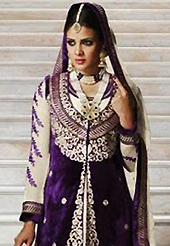 Outfit is a novel ways of getting yourself noticed. The dazzling purple and cream velvet and georgette jacket style churidar suit have amazing embroidery patch work is done with resham, zari, stone and beads work. Beautiful embroidery work on kameez is stunning. The entire ensemble makes an excellent wear. Matching cream santoon churidar and cream chiffon dupatta is available with this suit. Slight Color variations are possible due to differing screen and photograph resolutions.