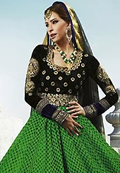 Get ready to sizzle all around you by sparkling suit. The dazzling green and black georgette anarkali churidar suit have amazing embroidery patch work is done with floral print, zari and stone work. Beautiful embroidery work on kameez is stunning. The entire ensemble makes an excellent wear. Matching black santoon churidar and black net dupatta is available with this suit. Slight Color variations are possible due to differing screen and photograph resolutions.