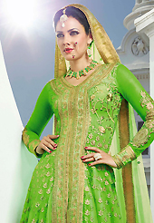 This season dazzle and shine in pure colors. The dazzling fluorescent green net anarkali churidar suit have amazing embroidery patch work is done with resham, zari and stone work. Beautiful embroidery work on kameez is stunning. The entire ensemble makes an excellent wear. Matching santoon churidar and chiffon dupatta is available with this suit. Slight Color variations are possible due to differing screen and photograph resolutions.