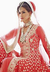 Look stunning rich with dark shades and floral patterns. The dazzling peach net anarkali churidar suit have amazing embroidery patch work is done with resham, zari and stone work. Beautiful embroidery work on kameez is stunning. The entire ensemble makes an excellent wear. Matching santoon churidar and chiffon dupatta is available with this suit. Slight Color variations are possible due to differing screen and photograph resolutions.