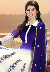 Breathtaking collection of suits with stylish embroidery work and fabulous style. The dazzling shaded blue and off white net anarkali churidar suit have amazing embroidery patch work is done with resham, zari, applique and sequins work. The entire ensemble makes an excellent wear. Matching off white santoon churidar and dark blue chiffon dupatta is available with this suit. Slight Color variations are possible due to differing screen and photograph resolutions.