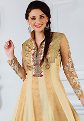 The glamorous silhouette to meet your most dire fashion needs. The dazzling cream and beige faux crepe jacquard and faux chiffon churidar suit have amazing embroidery patch work is done with resham, zari and lace work. The entire ensemble makes an excellent wear. Matching beige santoon churidar and double dye chiffon dupatta is available with this suit. Slight Color variations are possible due to differing screen and photograph resolutions.