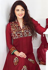 Get ready to sizzle all around you by sparkling suit. The dazzling maroon faux georgette churidar suit have amazing embroidery patch work is done with resham, zari, sequins and lace work. The entire ensemble makes an excellent wear. Matching santoon churidar and chiffon dupatta is available with this suit. Slight Color variations are possible due to differing screen and photograph resolutions.