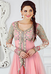 Outfit is a novel ways of getting yourself noticed. The dazzling pink net churidar suit have amazing embroidery patch work is done with resham, zari, sequins, stone, beads and lace work. The entire ensemble makes an excellent wear. Matching santoon churidar and chiffon dupatta is available with this suit. Slight Color variations are possible due to differing screen and photograph resolutions.