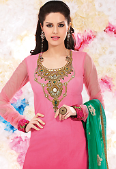 The glamorous silhouette to meet your most dire fashion needs. The dazzling shaded pink georgette churidar suit have amazing embroidery patch work is done with resham, zari, sequins and stone work. Beautiful embroidery work on kameez is stunning. The entire ensemble makes an excellent wear. Matching santoon churidar and green dupatta is available with this suit. Slight Color variations are possible due to differing screen and photograph resolutions.