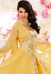 The color range from natural shades looks ravishing. The dazzling yellow georgette churidar suit have amazing embroidery patch work is done with resham, sequins and stone work. Beautiful embroidery work on kameez is stunning. The entire ensemble makes an excellent wear. Matching santoon churidar and chiffon dupatta is available with this suit. Slight Color variations are possible due to differing screen and photograph resolutions.