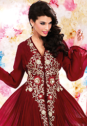 Your search for elegant look ends here with this lovely suit. The dazzling maroon georgette churidar suit have amazing embroidery patch work is done with resham, sequins and stone work. Beautiful embroidery work on kameez is stunning. The entire ensemble makes an excellent wear. Matching santoon churidar and chiffon dupatta is available with this suit. Slight Color variations are possible due to differing screen and photograph resolutions.