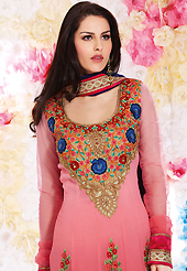 It is color this season and bright shaded suits are really something that is totally in vogue. The dazzling shaded pink georgette churidar suit have amazing embroidery patch work is done with resham, sequins, stone and lace work. Beautiful embroidery work on kameez is stunning. The entire ensemble makes an excellent wear. Matching santoon churidar and dark blue chiffon dupatta is available with this suit. Slight Color variations are possible due to differing screen and photograph resolutions.
