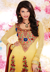This season dazzle and shine in pure colors. The dazzling shaded yellow georgette churidar suit have amazing embroidery patch work is done with resham, sequins, stone and lace work. Beautiful embroidery work on kameez is stunning. The entire ensemble makes an excellent wear. Matching santoon churidar and maroon chiffon dupatta is available with this suit. Slight Color variations are possible due to differing screen and photograph resolutions.