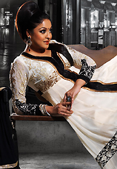 Dreamy variation on shape and forms compliment your style with tradition. The dazzling off white faux georgette anarkali churidar suit have amazing embroidery patch work is done with resham and zari work. Beautiful embroidery work on kameez is stunning. The entire ensemble makes an excellent wear. Matching santoon churidar and black chiffon dupatta is available with this suit. Slight Color variations are possible due to differing screen and photograph resolutions.