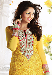 An occasion wear perfect is ready to rock you. The dazzling yellow net churidar suit have amazing embroidery patch work is done with resham, gold zardosi, sequins, stone, cutdana and beads work. Beautiful embroidery work on kameez is stunning. The entire ensemble makes an excellent wear. Matching churidar and chiffon dupatta is available with this suit. Slight Color variations are possible due to differing screen and photograph resolutions.