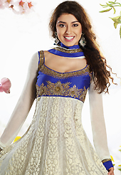 Take a look on the changing fashion of the season. The dazzling off white and dark blue net churidar suit have amazing embroidery patch work is done with resham, zari, sequins, stone, cutdana and beads work. Beautiful embroidery work on kameez is stunning. The entire ensemble makes an excellent wear. Matching dark blue churidar and off white chiffon dupatta is available with this suit. Slight Color variations are possible due to differing screen and photograph resolutions.
