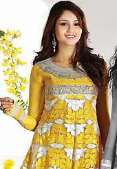 A desire that evokes a sense of belonging with a striking details. The dazzling yellow and white net churidar suit have amazing embroidery patch work is done with resham, zari, sequins, stone and lace work. Beautiful embroidery work on kameez is stunning. The entire ensemble makes an excellent wear. Matching churidar and dupatta is available with this suit. Slight Color variations are possible due to differing screen and photograph resolutions.