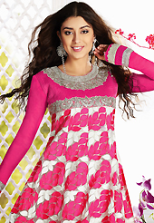 Outfit is a novel ways of getting yourself noticed. The dazzling pink and white net churidar suit have amazing embroidery patch work is done with resham, zari, sequins, stone and lace work. Beautiful embroidery work on kameez is stunning. The entire ensemble makes an excellent wear. Matching churidar and dupatta is available with this suit. Slight Color variations are possible due to differing screen and photograph resolutions.