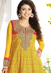 The glamorous silhouette to meet your most dire fashion needs. The dazzling yellow net churidar suit have amazing embroidery patch work is done with resham, zari, sequins, stone, cutdana and lace work. Beautiful embroidery work on kameez is stunning. The entire ensemble makes an excellent wear. Matching churidar and dupatta is available with this suit. Slight Color variations are possible due to differing screen and photograph resolutions.