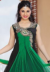 A desire that evokes a sense of belonging with a striking details. The dazzling green and black net readymade churidar suit have amazing embroidery patch work is done with zari, stone and cutdana work. The entire ensemble makes an excellent wear. Matching churidar and dupatta is available with this suit. Slight Color variations are possible due to differing screen and photograph resolutions.