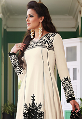 Take a look on the changing fashion of the season. The dazzling off white lawn cotton churidar suit have amazing embroidery patch work is done with resham and beads work. The entire ensemble makes an excellent wear. Matching cambric cotton churidar and black and off white chiffon dupatta is available with this suit. Slight Color variations are possible due to differing screen and photograph resolutions.