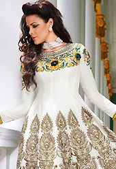 Your search for elegant look ends here with this lovely suit. The dazzling white lawn cotton anarkali churidar suit have amazing embroidery patch work is done with resham and beads work. The entire ensemble makes an excellent wear. Contrasting yellow cambric cotton churidar and off white chiffon dupatta is available with this suit. Slight Color variations are possible due to differing screen and photograph resolutions.