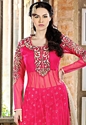 Take a look on the changing fashion of the season. The dazzling dark pink net churidar suit have amazing embroidery patch work is done with resham, sequins and stone work. Beautiful embroidery work on kameez is stunning. The entire ensemble makes an excellent wear. Matching churidar and dark cream dupatta is available with this suit. Slight Color variations are possible due to differing screen and photograph resolutions.