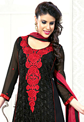A desire that evokes a sense of belonging with a striking details. The dazzling black faux georgette churidar suit have amazing embroidery patch work is done with resham and lace work. Contrasting dark red santoon churidar and dark red chiffon dupatta is available with this suit. Slight Color variations are possible due to differing screen and photograph resolutions.