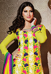 Look stunning rich with dark shades and floral patterns. The dazzling yellow chiffon anarkali churidar suit have amazing embroidery patch work is done with resham, zari and lace work. Beautiful embroidery work on kameez is stunning. The entire ensemble makes an excellent wear. Matching santoon churidar and chiffon dupatta is available with this suit. Slight Color variations are possible due to differing screen and photograph resolutions.