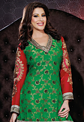 Dreamy variation on shape and forms compliment your style with tradition. The dazzling green viscose georgette and jacquard sharara kameez have amazing embroidery patch work is done with resham, zari, sequins and lace work. Beautiful embroidery work on kameez is stunning. The entire ensemble makes an excellent wear. Contrasting white sharara and red chiffon dupatta is available with this suit. Slight Color variations are possible due to differing screen and photograph resolutions.
