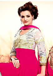 A desire that evokes a sense of belonging with a striking details. The dazzling dark pink and off white georgette anarkali churidar suit have amazing embroidery patch work is done with resham, zari and lace work. Beautiful embroidery work on kameez is stunning. The entire ensemble makes an excellent wear. Matching dark pink santoon churidar and dark pink chiffon dupatta is available with this suit. Slight Color variations are possible due to differing screen and photograph resolutions.