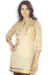 This Beige cotton tunic is designed with resham embroidery work on neckline in floral patterns. This is a perfect casual wear. Slight Color variations are possible due to differing screen and photograph resolutions.