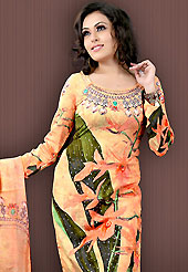 Stylish and beautiful work tunic. This light orange faux crepe tunic is designed with beautiful combination of digital print and sequins work in form of floral and abstract motifs. Beautiful printed faux georgette stole is available with this tunic. Bottom shown in the image is just for photography purpose. Slight Color variations are possible due to differing screen and photograph resolutions.