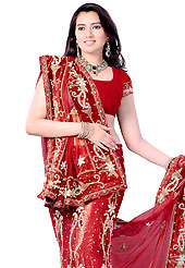 Make your collection more attractive and charming with this impressive dress. This red net and jacquard fishtail lehenga choli is nicely embroidered and velvet patch work done with sequins, stone, kasab, beads and cutdana work in form of floral and paisley motifs. Beautiful hand embroidery work on lehenga is stunning. The beautiful embroidery on lehenga made it awesome and gives you stylish and attractive look to others. Matching choli and dupatta is availble with this lehenga. Slight Color variations are possible due to differing screen and photograph resolutions.