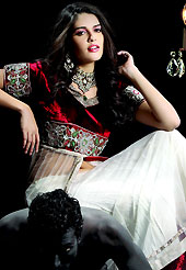 Make your collection more attractive and charming with this impressive dress. This off white and maroon net lehenga choli is nicely embroidered and patch work done with stone and beads work in form of floral motifs. Embroidery long jacket style choli on lehenga is stunning. The beautiful embroidery on lehenga made it awesome and gives you stylish and attractive look to others. Matching choli and dupatta is availble with this lehenga. Slight Color variations are possible due to differing screen and photograph resolutions.