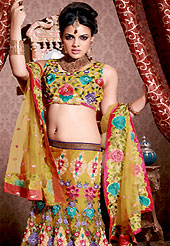 Make your collection more attractive and charming with this impressive dress. This dark yellow net lehenga choli is nicely embroidered and patch work done with resham, sequins and stone work in form of floral motifs. All over embroidery on lehenga made it awesome and gives you stylish and attractive look to others. Matching choli and dupatta is availble with this lehenga. Slight Color variations are possible due to differing screen and photograph resolutions.